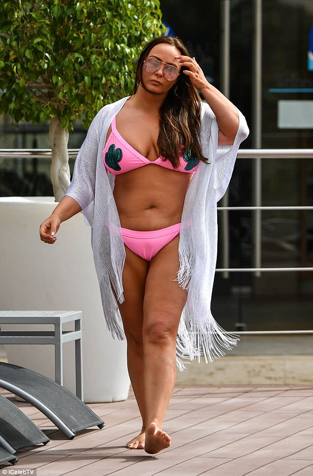 Blissful break: The reality veteran was looking noticeably slimmer as she larked about by the poolside