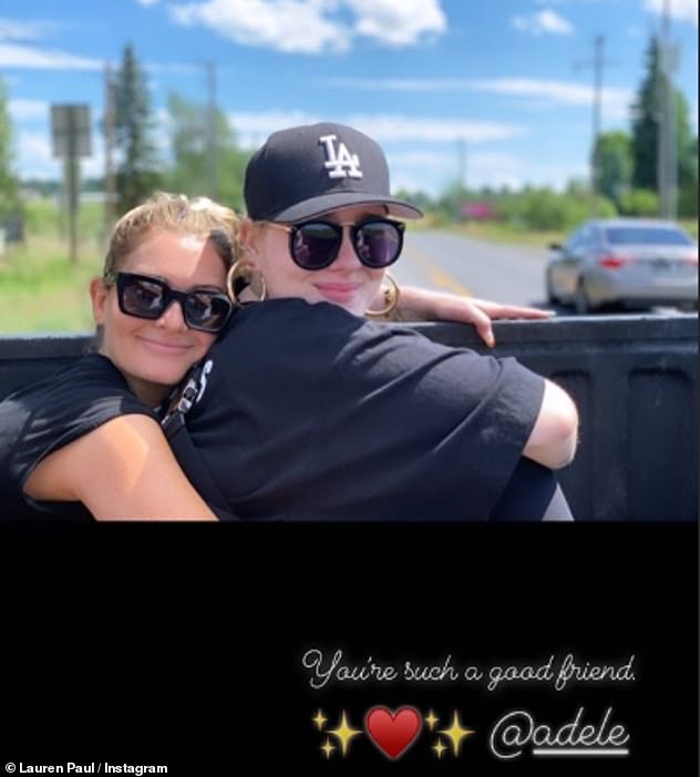 Long-term pals: Lauren also shared this throwback picture of herself hugging Adele while they were out on a road trip