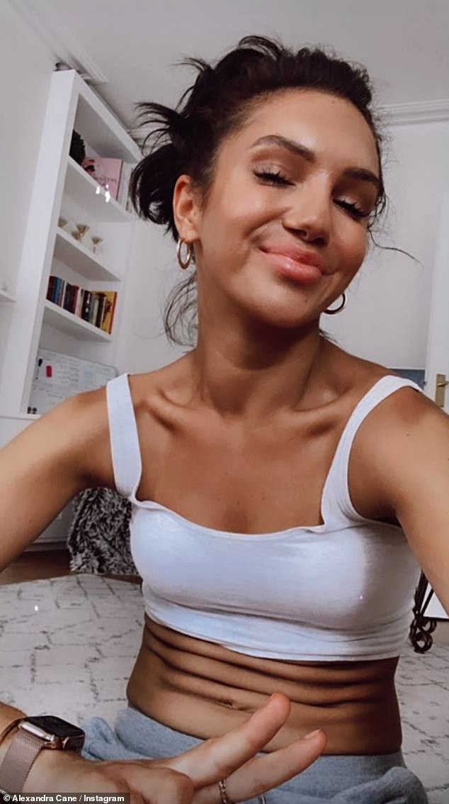 Angles: Alexandra took a picture in a white crop to show how the difference in posture can alter your physique
