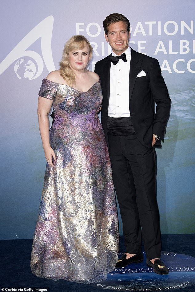 Power couple: Rebel used the event to debut her new boyfriend, Jacob Busch (right)