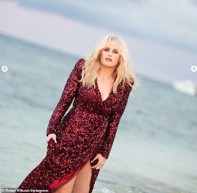 Fun: Rebel looked like she was having a great time on the shoot as she paddled through the water and posed up a storm